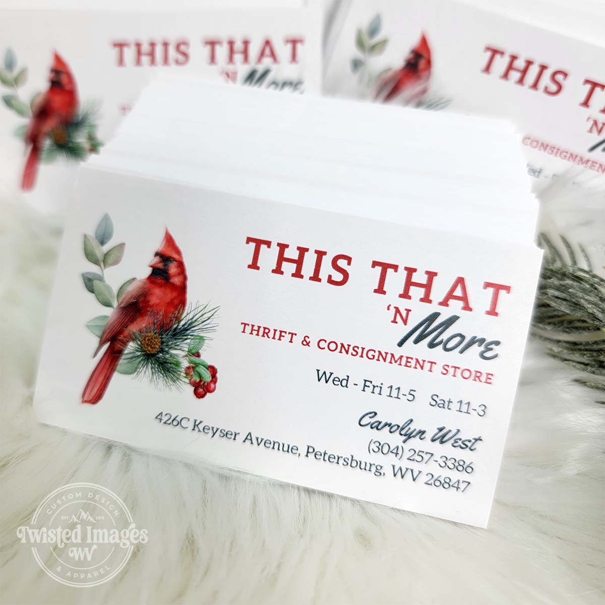 High-quality custom business card printing example showing a white stack of premium cards with professional graphic design.