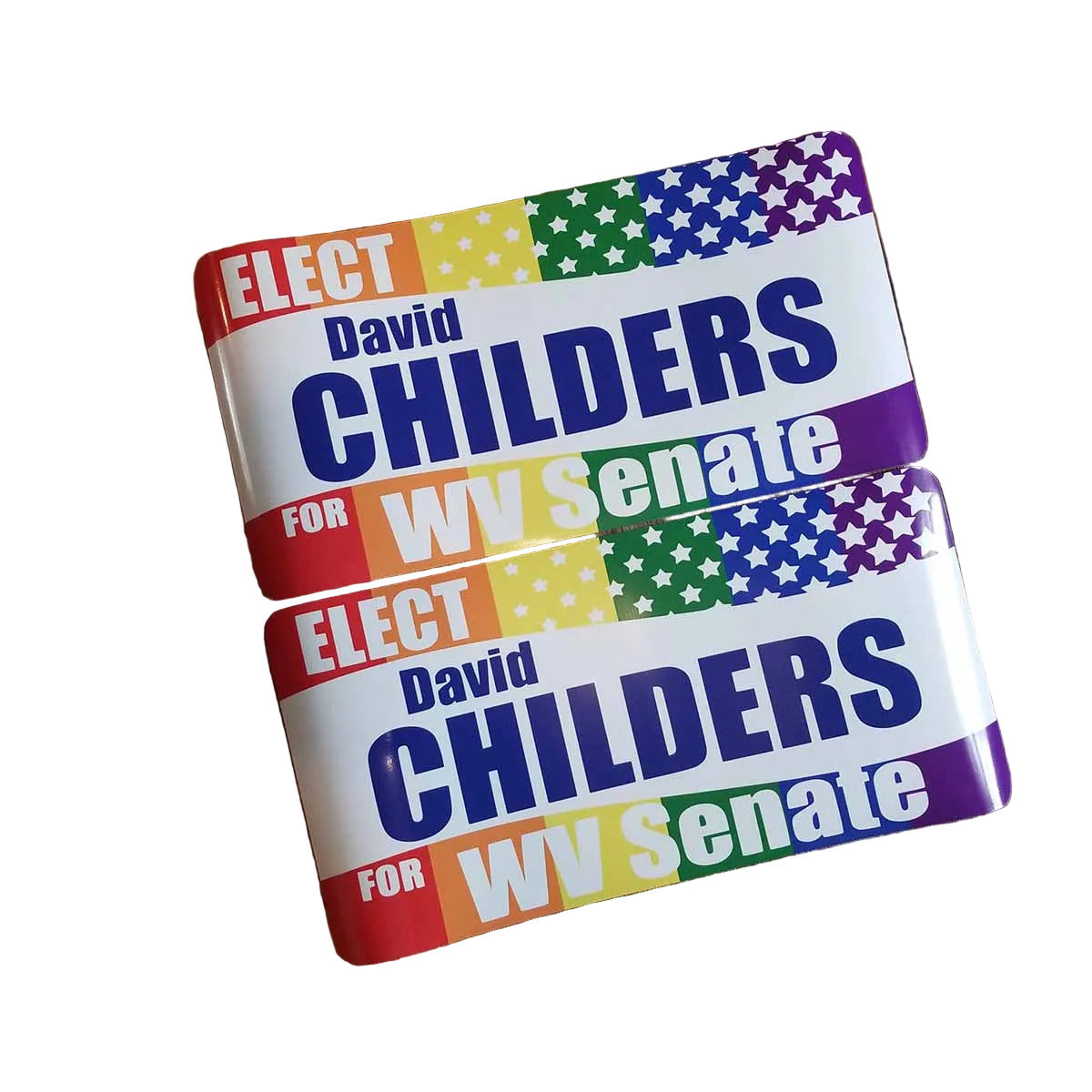 Two identical political campaign signs for WV Senate are stacked diagonally on a dark wood floor. The signs feature a white background with bold blue text, a red, yellow, and white star pattern, and a purple border.