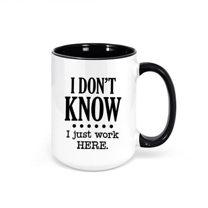 I Don’t Know, I Just Work Here ceramic coffee mug with bold black lettering.