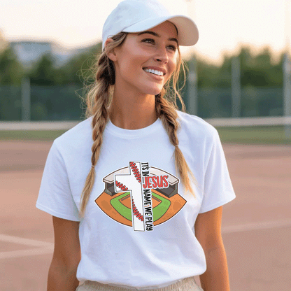 Woman wearing a white Christian baseball t-shirt with a cross and baseball field graphic.
