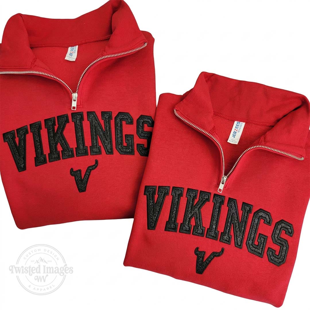 Two red VIKINGS embroidered sweatshirts with a zipper on a white background.